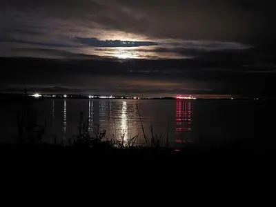 a view of a body of water at night at Vault 21 in Millom