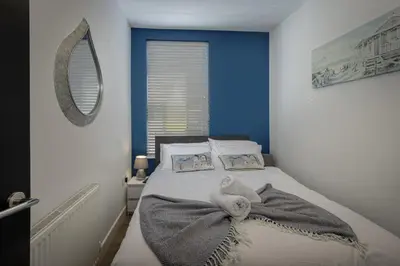 a bedroom with a bed with a towel on it at Blackpool Abode - 20 Bairstow Street in Blackpool
