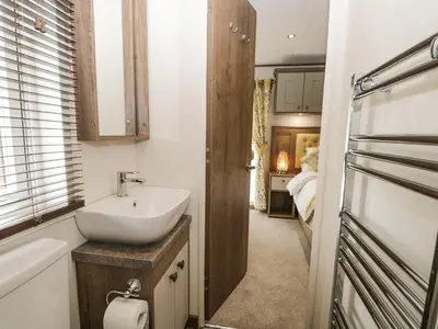 a bathroom with a sink and a bath tub at Ashton Lodge - Sherwood 4 in Carnforth