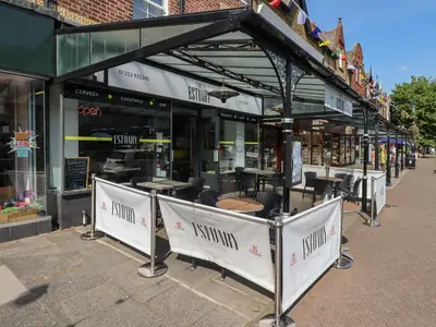 a restaurant with tables and chairs in front of a building at The Bothy in Lytham St Annes
