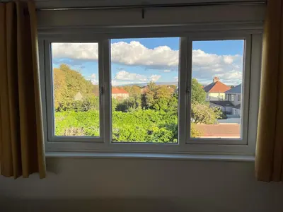 a window with a view of a yard at Bare, Morecambe - Parking EV, 2 Bathrooms, 3 King Bedrooms, Good Area in Morecambe