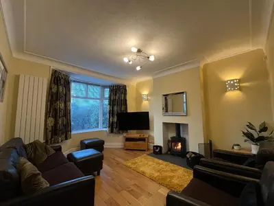 a living room with a couch and a fire place at Bare, Morecambe - Parking EV, 2 Bathrooms, 3 King Bedrooms, Good Area in Morecambe