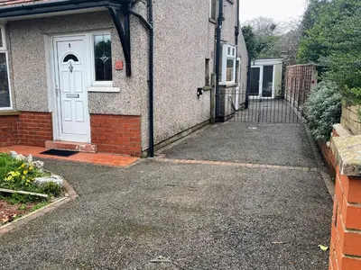 a driveway leading to a house with a white door at Bare, Morecambe - Parking EV, 2 Bathrooms, 3 King Bedrooms, Good Area in Morecambe