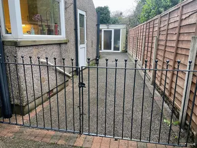 a wrought iron fence in front of a house at Bare, Morecambe - Parking EV, 2 Bathrooms, 3 King Bedrooms, Good Area in Morecambe