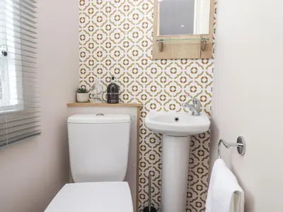 a bathroom with a toilet and a sink at 25 Sherwood in Carnforth