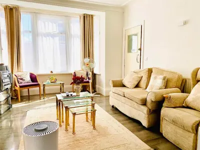 a living room with a couch and a table at Number 36 in Blackpool
