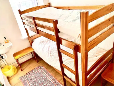 a bunk bed in a room with a sink at Number 36 in Blackpool
