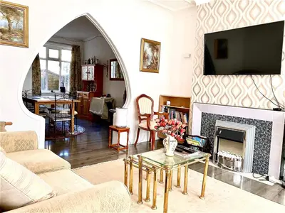 a living room with a couch and a fireplace at Number 36 in Blackpool