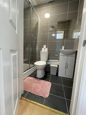 a bathroom with a toilet and a shower at Ariana House Hotel-Families and Couples Only in Blackpool