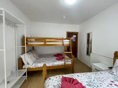 a bedroom with two bunk beds in a room at Ariana House Hotel-Families and Couples Only in Blackpool