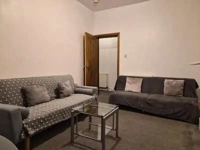 a living room with a couch and a coffee table at Blackpool Apartments in Blackpool
