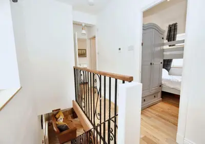 a staircase leading to a bedroom with a bunk bed at Bowland Breaks - Cobble View Cottage with Private Parking Near all the local Wedding Venues in Waddington