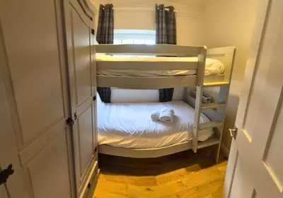 a small room with two bunk beds in it at Bowland Breaks - Cobble View Cottage with Private Parking Near all the local Wedding Venues in Waddington