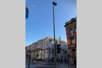 a traffic light on a street in front of a building at Superb City Centre Location in Liverpool