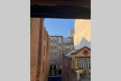 a view from a window of an alley with buildings at Superb City Centre Location in Liverpool