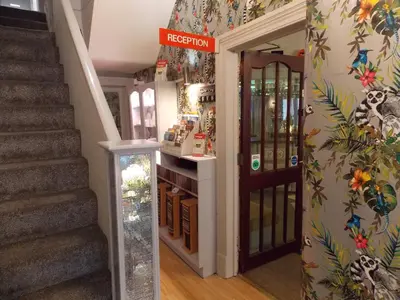 a store with a staircase and a door in a room at The Rockley Hotel in Blackpool