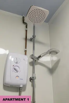 a shower with a shower head in a bathroom at St Luke's 2 in Liverpool