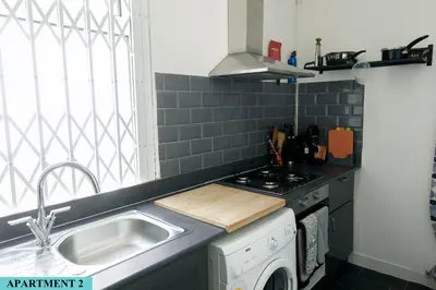 a kitchen with a sink and a stove at St Luke's 2 in Liverpool