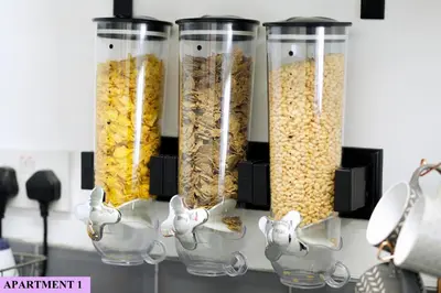 a group of four glass containers filled with cereal at St Luke's 2 in Liverpool