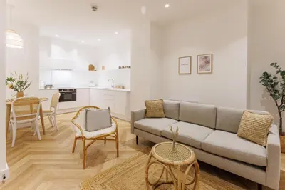 a living room with a couch and a table at 44 Renshaw Apart Hotel in Liverpool