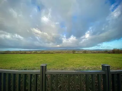 a view of a large field with a fence at ViewLangho in Blackburn