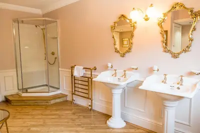 a bathroom with two sinks and a shower at The Farmhouse at Ream Hills in Weeton