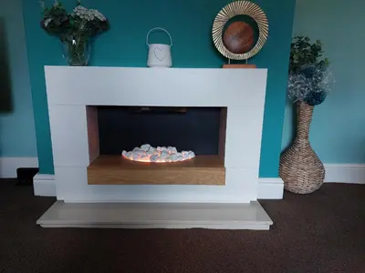 a living room with a fireplace with a fire place at Lovely 2 bedroomed flat in the centre of Longton in Longton