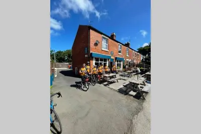 a group of bikes parked outside of a building at Lovely 2 bedroomed flat in the centre of Longton in Longton