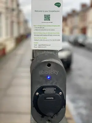 a sign on the side of a parking meter at Entire 4 bedroom House - EV POINT & FREE PARKING in Liverpool