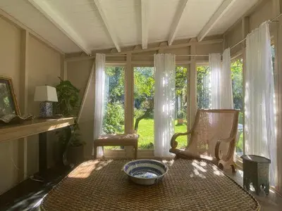 a room with a table and a chair and a window at Lyndhurst - Victorian villa with heated pool in Roby