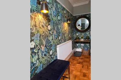 a room with a wall covered in floral wallpaper at Mayfield Apartment Luxury first floor 1 bedroom apartment in Great Eccleston