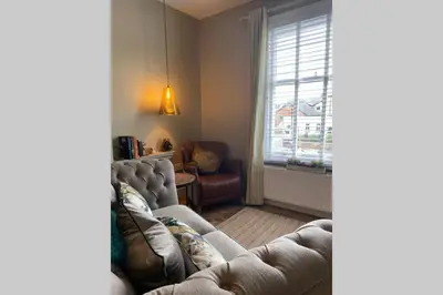 a living room with a couch and a chair and a window at Mayfield Apartment Luxury first floor 1 bedroom apartment in Great Eccleston