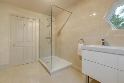 a bathroom with a shower and a sink at Blackpool Abode - Southlands in Blackpool