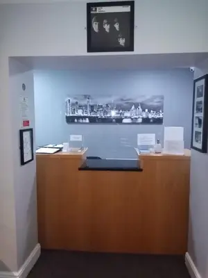 a room with a counter with a picture on the wall at The Liverpool Inn Hotel in Liverpool