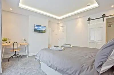 a bedroom with a bed and a desk at Malleus House in Barrow in Furness