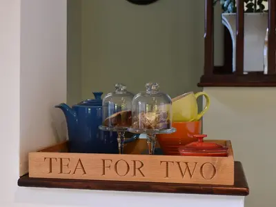 a sign that says tea for two on a tray at Garden Cottage in Sabden
