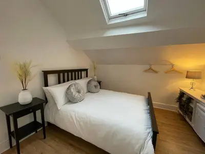 a bedroom with a white bed and a window at CityStays Rooms with Free Parking in Liverpool