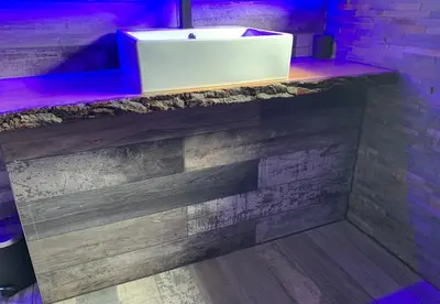 a counter with a white sink in a room at BREEZE SUITES - LUXURY GROUP ACCOM - SLEEPS 19 in Blackpool