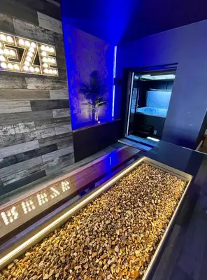 a room with a jukebox with a pile of rocks at BREEZE SUITES - LUXURY GROUP ACCOM - SLEEPS 19 in Blackpool