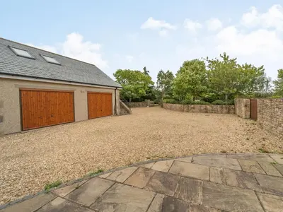 a driveway of a house with a garage at Highfield Cottage in Poulton le Fylde