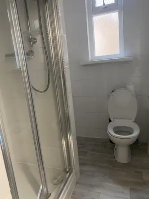 a bathroom with a toilet and a shower at Blackpool Abode - The Cinema House in Blackpool
