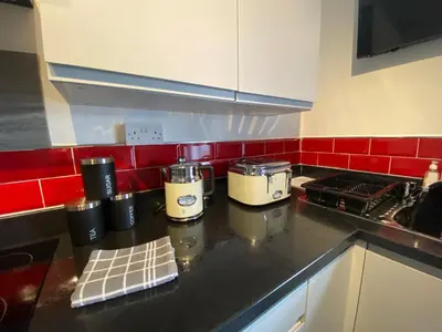 a kitchen counter with two appliances on a counter top at Blackpool Abode - 124 Elite Apartments in Blackpool