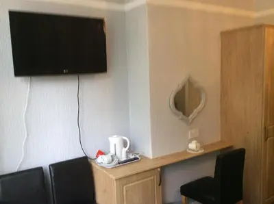 a room with a flat screen tv on the wall at Beaucliffe continental in Blackpool