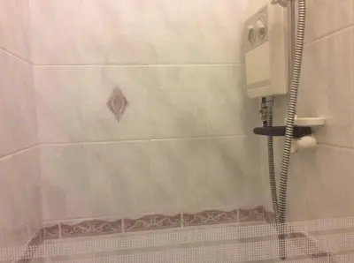 a shower in a bathroom with a shower curtain at Beaucliffe continental in Blackpool