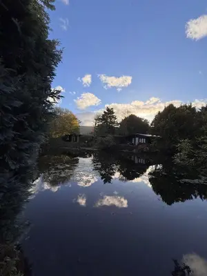a view of a river with clouds in the water at Little Wren Cartmel Couples Retreat in Cartmel