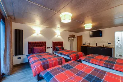 a room with two beds in a room at Alberts Apartments in Liverpool