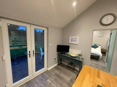 a room with a desk and a clock on the wall at Beautiful self-catering cottages, Ribble Valley in West Bradford