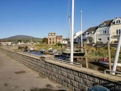 a group of boats are docked in a harbor at Harbour View in Millom