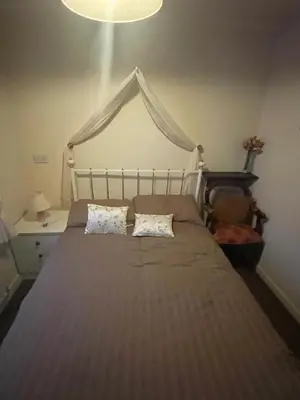 a bed with two pillows on it in a bedroom at Highbury Hotel in Blackpool