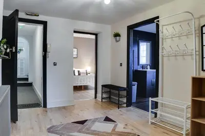 a hallway with two doors leading to a bathroom at InstaLet Apartments I Wigan Central I Free Parking in Wigan